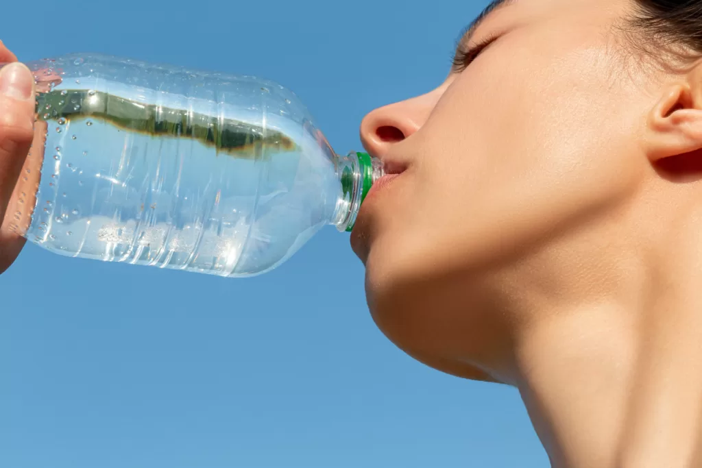 We’re not just swallowing water from plastic bottles but microplastics which do not degrade easily and remain in our bodies. : Girl drinks water from a plastic bottle
by Wuestenigel is available at https://bit.ly/3H0F7PH CC BY 2.0