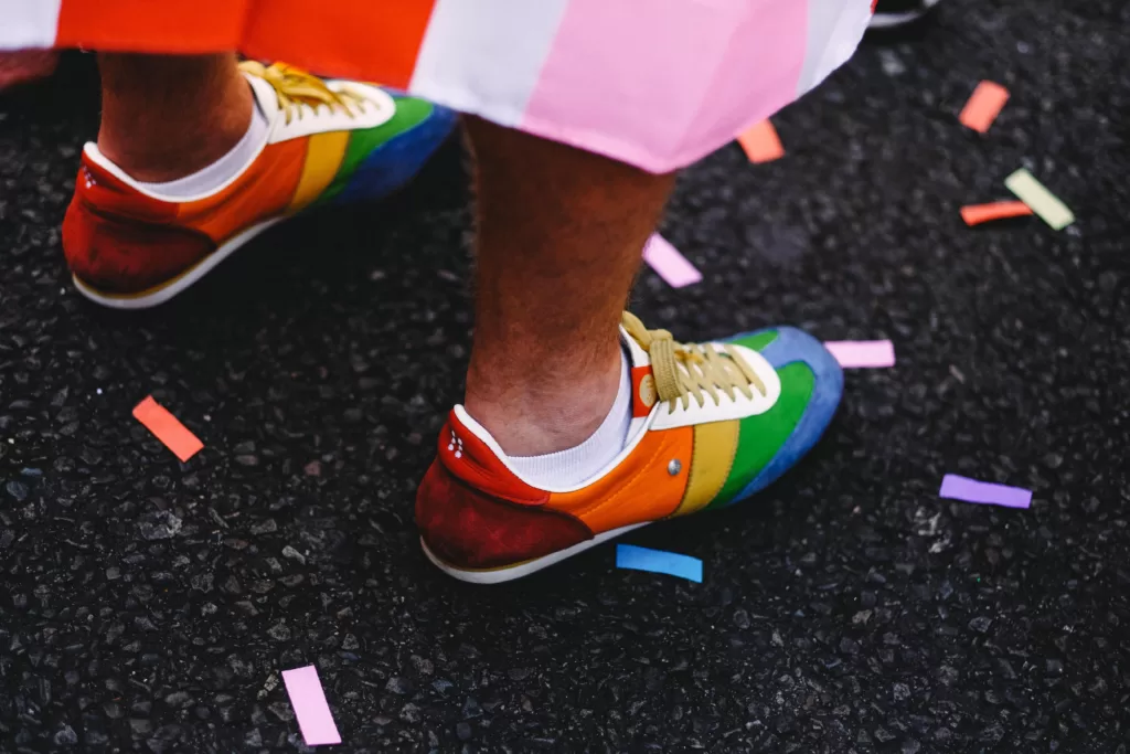The 2023 Gay Games follow months of global headlines focusing on debates around which gender divisions transgender athletes should be allowed (or not allowed) to compete in. : Clem Onojeghuo via Unsplash (https://unsplash.com/photos/person-wearing-multicolored-low-top-shoes-standing-on-ground-mlicb5TEmUM) Free to use under the Unsplash License