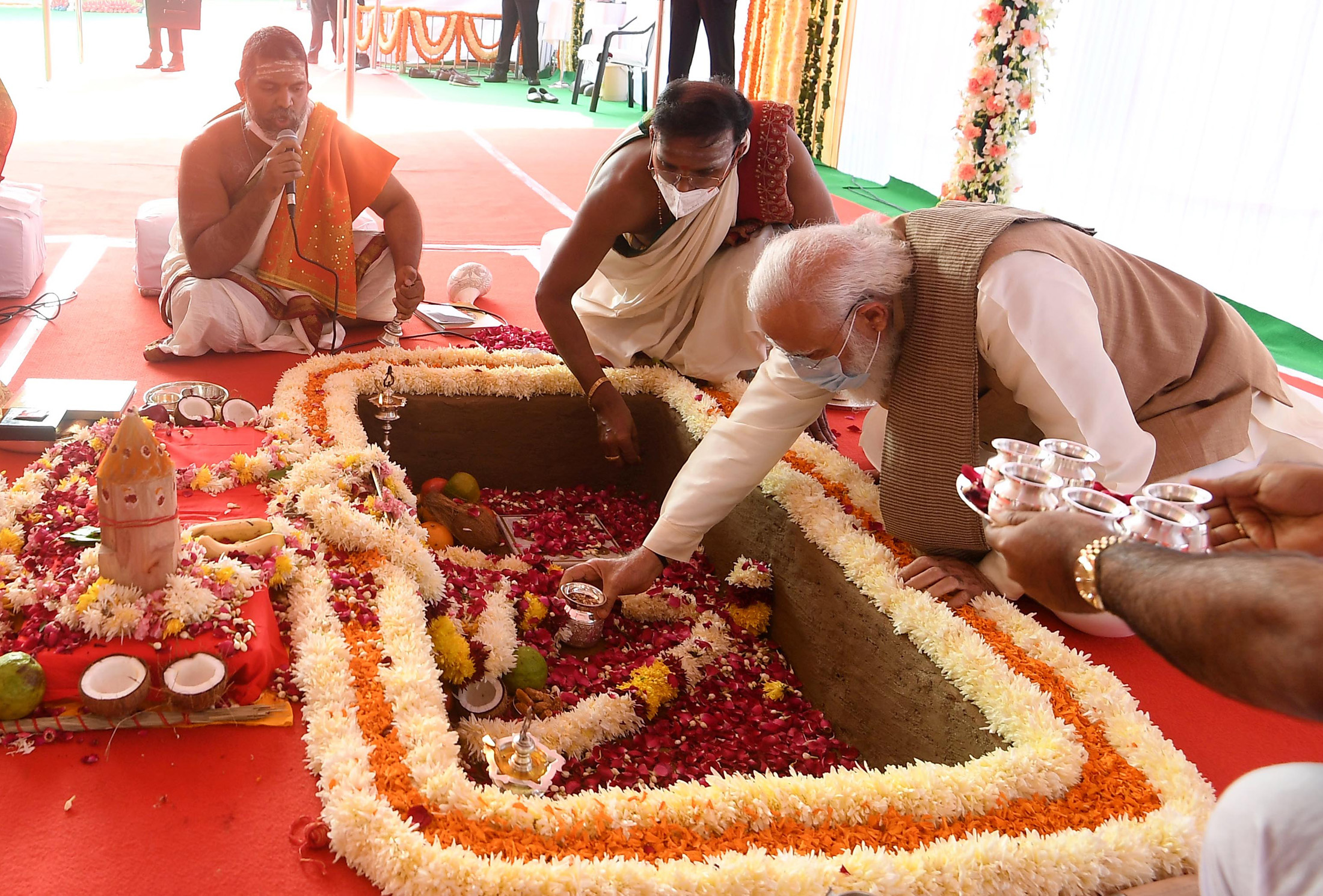 India’s Prime Minister Narendra Modi performing a Hindu ritual, ‘Bhoomi Pujan’, at the foundation stone laying ceremony of the country’s new parliament building : Press Information Bureau, Government of India