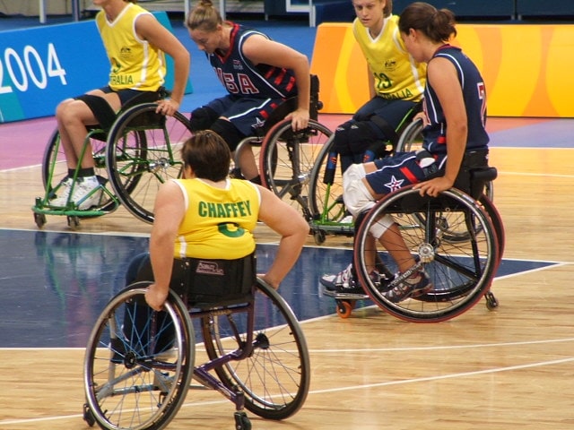 Co-author Lisa Chaffey in action at the Athens Paralympics in 2004.  Australia has more than 100 assistive technology funding schemes. : Chaffey Family CCBY4.0