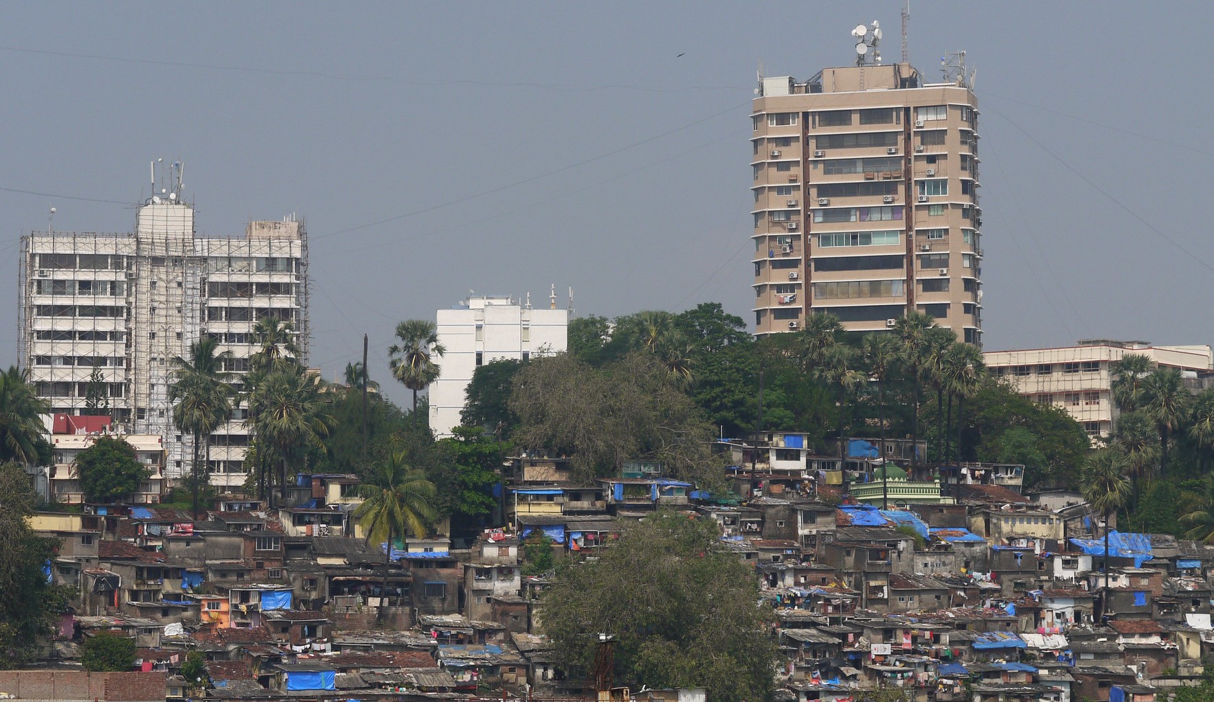 The rapid growth of slums across India’s cities, such as these in Mumbai, represents not just an urban planning challenge but a humanitarian crisis. : Christian Croft via Flickr CC BY-NC-ND 2.0