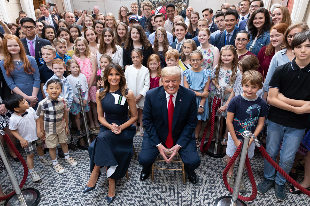 Then-President Donald Trump and First Lady Melania Trump participate in the Tri-Mission Embassy Meet and Greet in Brussels in 2018 : Official White House Photo by Andrea Hanks, available at https://commons.wikimedia.org/wiki/File:Donald_%26_Melania_Trump_2018-07-11_02.jpg Public domain